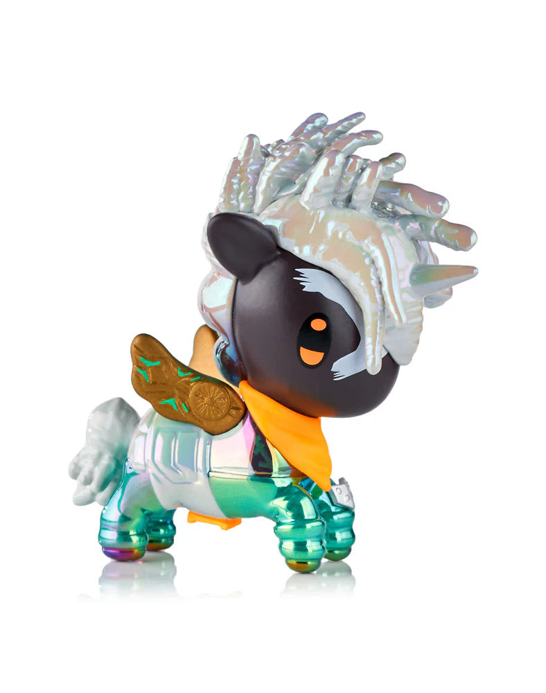 tokidoki x ARCANE Unicorno Black Light Chrome Blind Box figurine featuring a metallic-green pegacorn with gold wings, orange neckerchief, and pearl-white mane.