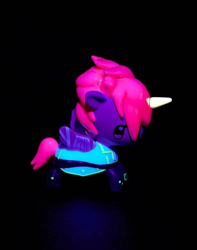 tokidoki x ARCANE Unicorno Black Light Chrome Blind Box figurine, neon-colored unicorn glowing vividly against black, perfect for collectors and fans of art toys.