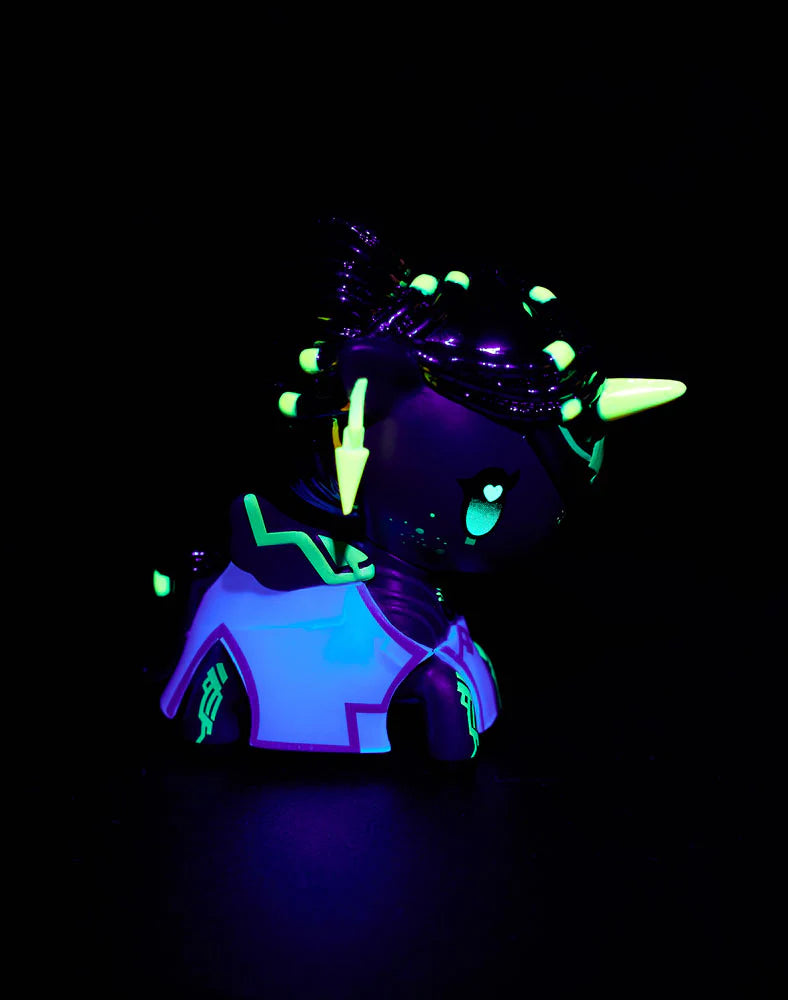 tokidoki x ARCANE Unicorno Black Light Chrome Blind Box figurine, glowing under UV light with futuristic accents, featuring a horn, heart markings, and circuit patterns.