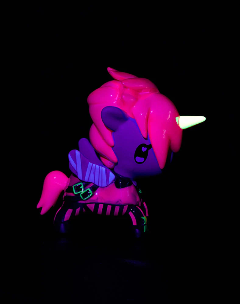 tokidoki x ARCANE Unicorno Black Light Chrome Blind Box: A 2.75-inch vinyl unicorn with neon accents, glowing under UV light. Collectible art piece, not a toy.