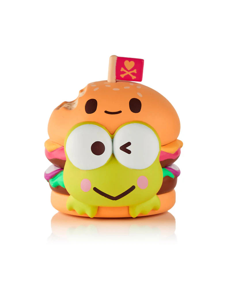 Kawaii squishy toy of a cheeseburger with a cartoon frog, featuring a heart and crossbones flag. Part of tokidoki x Hello Kitty and Friends Fast Food Blind Box.