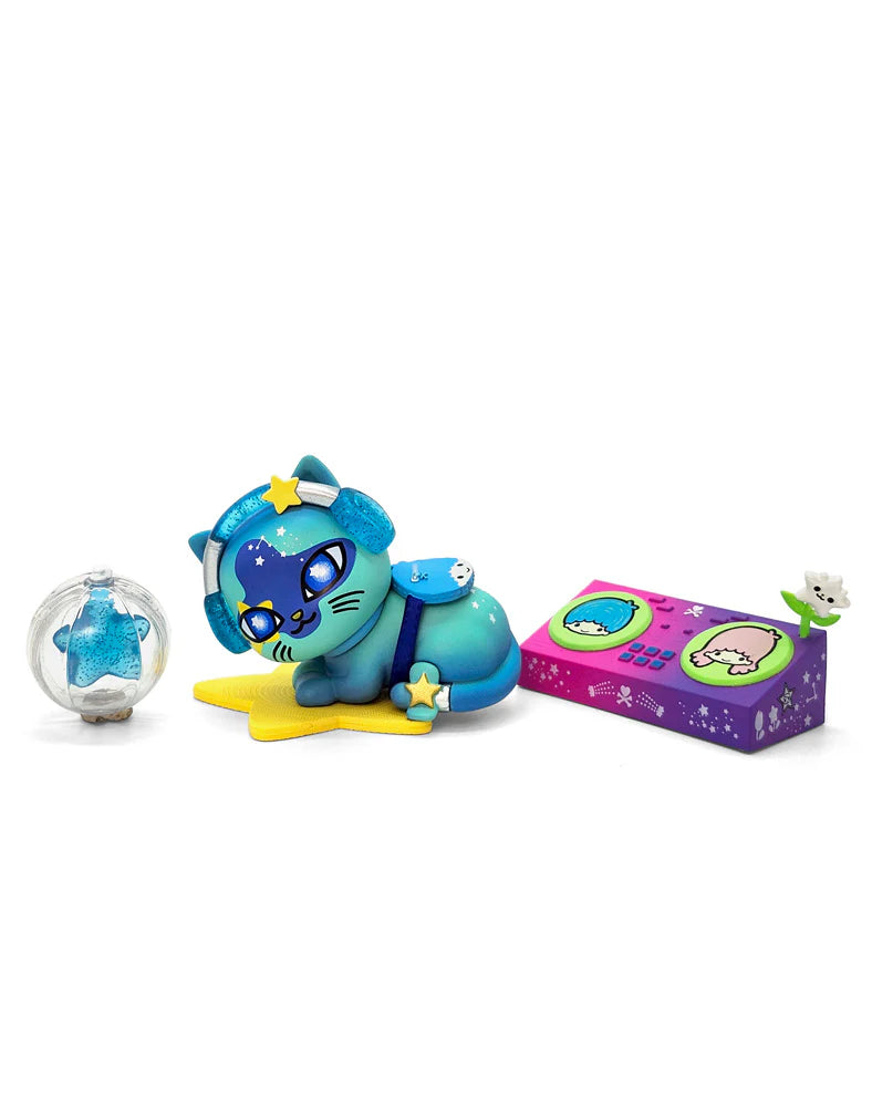 Designer toy set tokidoki Galactic Cats x Hello Kitty & Friends Blind Box featuring a turquoise cat on a star, a glittery capsule, and a DJ deck accessory.