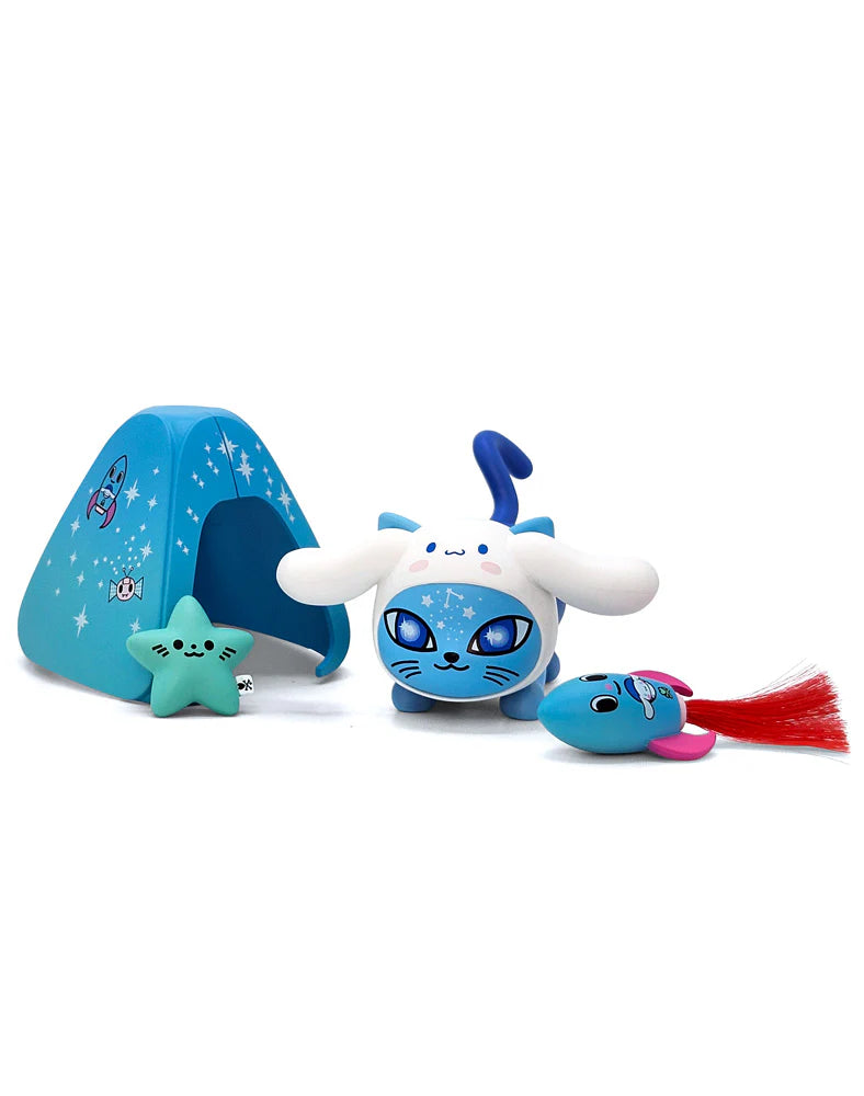 tokidoki Galactic Cats x Hello Kitty & Friends Blind Box featuring a blue cat figure with bunny-ear hood, pet-tent, star toy, and fish teaser accessory.