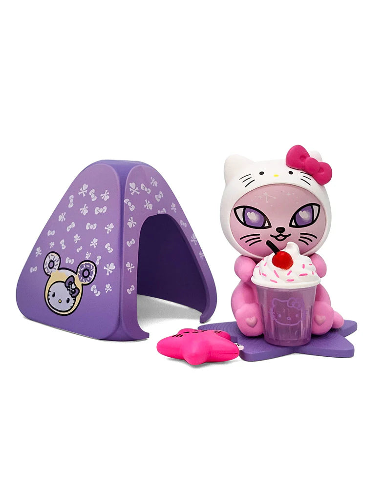 Sugar Whiskers x Hello Kitty play-set features a cat figure with a dessert drink, purple tent, and star accessory.