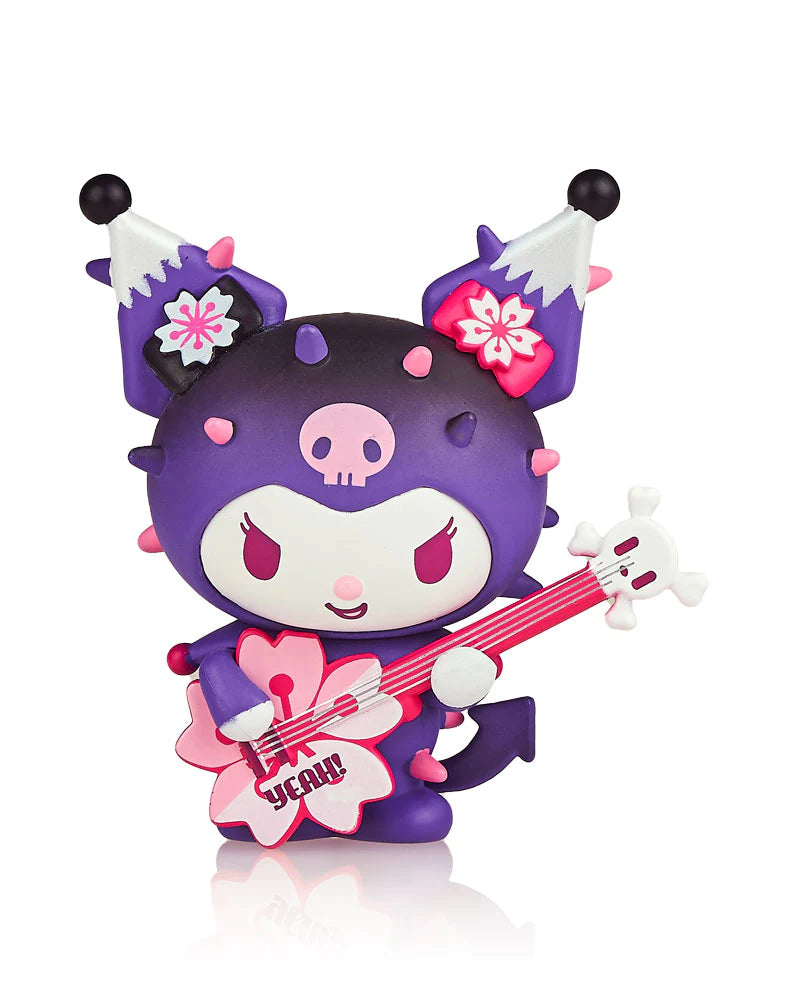A tokidoki x Hello Kitty and Friends Series 3 Blind Box featuring a toy dragon figurine playing a guitar.