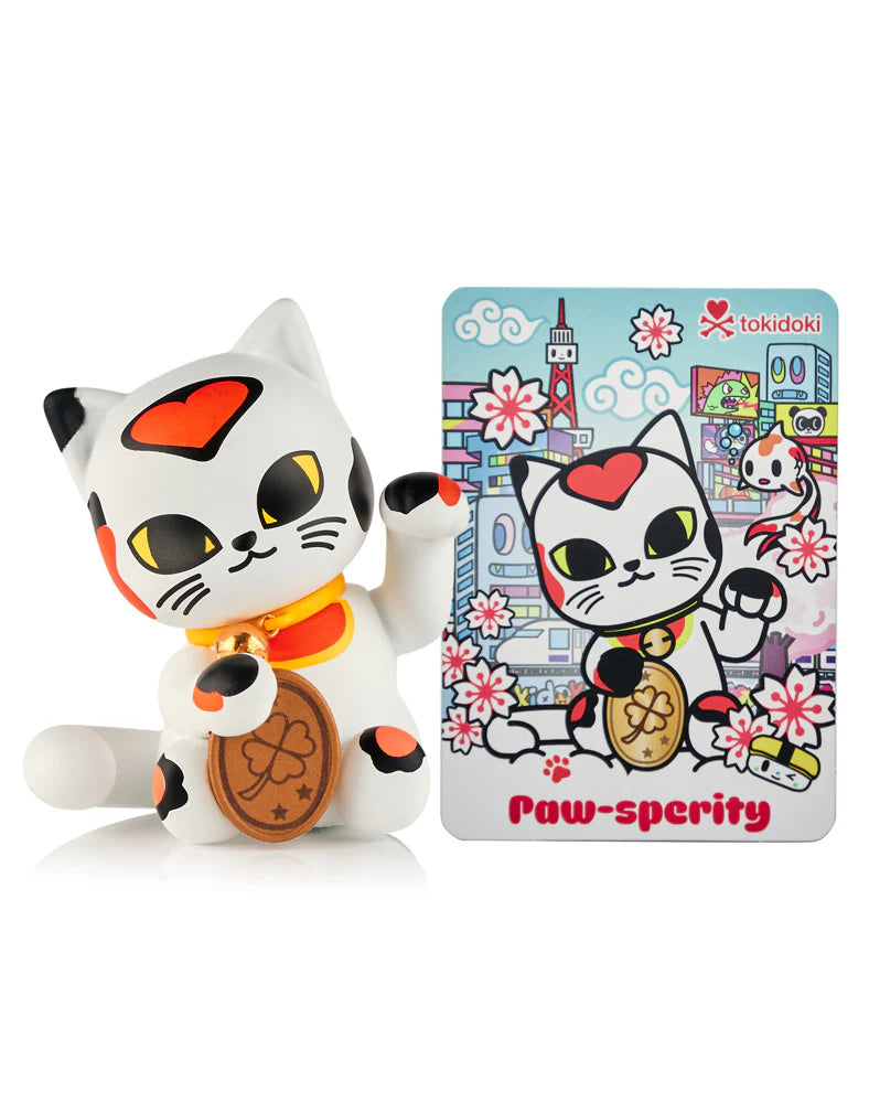 Tokidoki Maneki-Neko vinyl collectible, featuring a white calico cat with a four-leaf clover coin and matching art card from Lucky Cats Blind Box series.