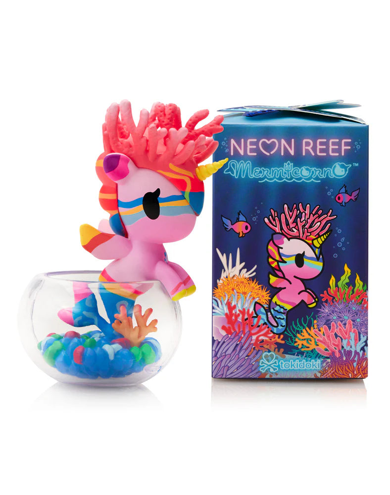 Neon Reef Mermicorno vinyl figure in a fishbowl with coral, alongside its box featuring matching artwork and product details.