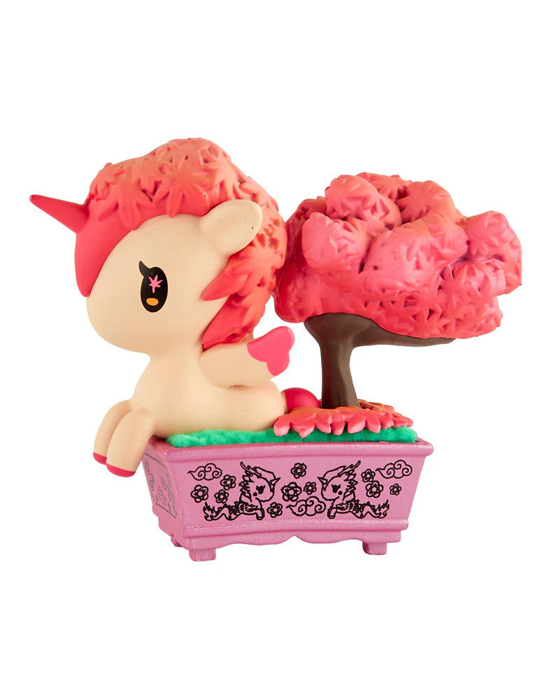 Botanical Bonsai Unicorno figurine with pink details in a decorated planter, featuring a bonsai-style tree; part of a blind box collectible series at Strangecat Toys.