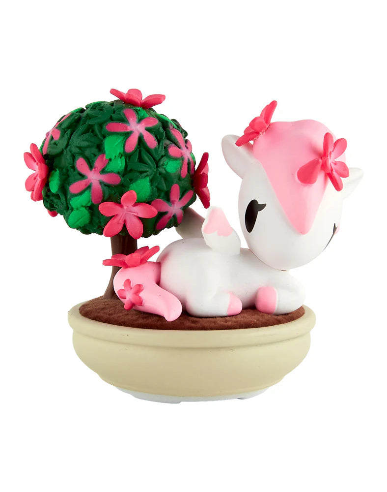 Botanical Bonsai Unicorno Blind Box featuring a kawaii white-and-pink unicorn beside a pink-flowered bonsai tree, embodying miniature garden charm.