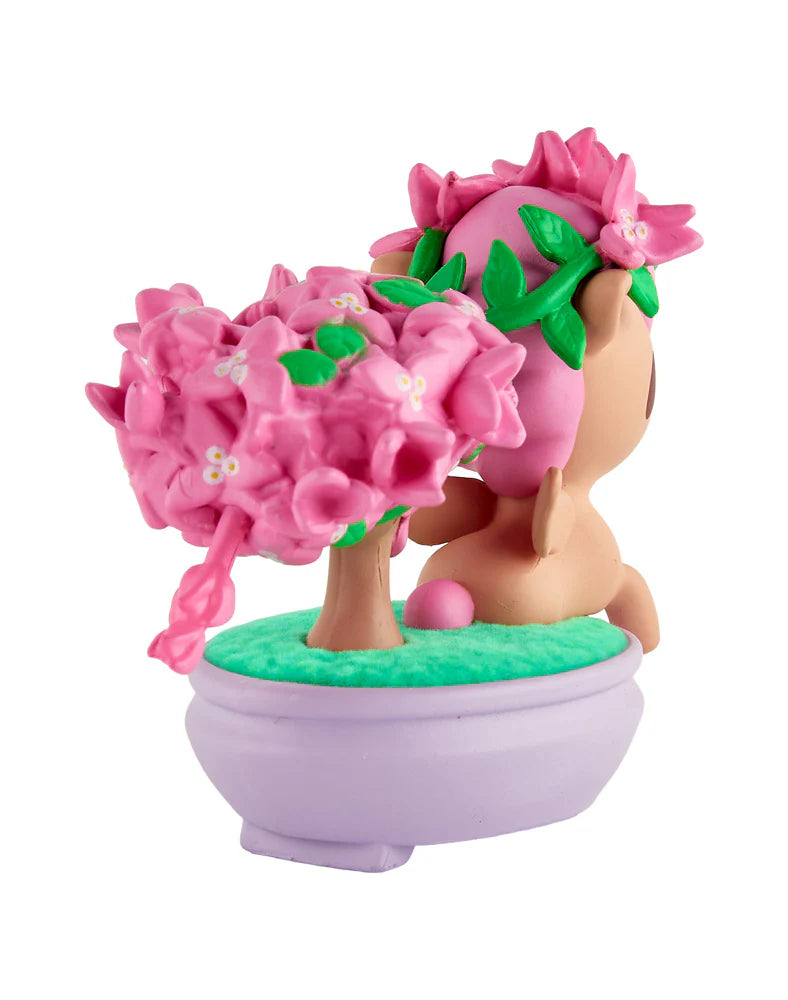 Botanical Bonsai Unicorno - Pink Bougainvillea Bonsai: A whimsical chibi creature beside a blossoming bonsai, set in a lavender planter. Collectible art piece from Strangecat Toys.
