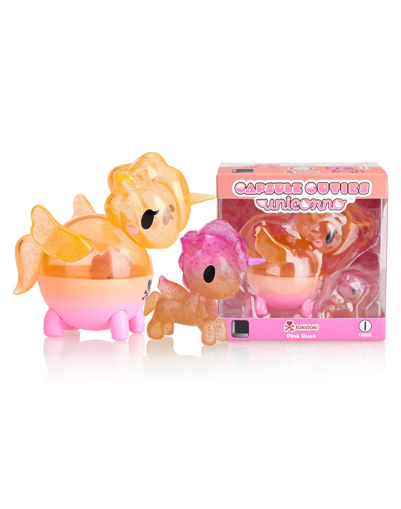 Capsule Cuties Unicorno - Pink Dusk (Special Edition) in open-box format, featuring a mini Unicorno inside, alongside a sticker sheet.