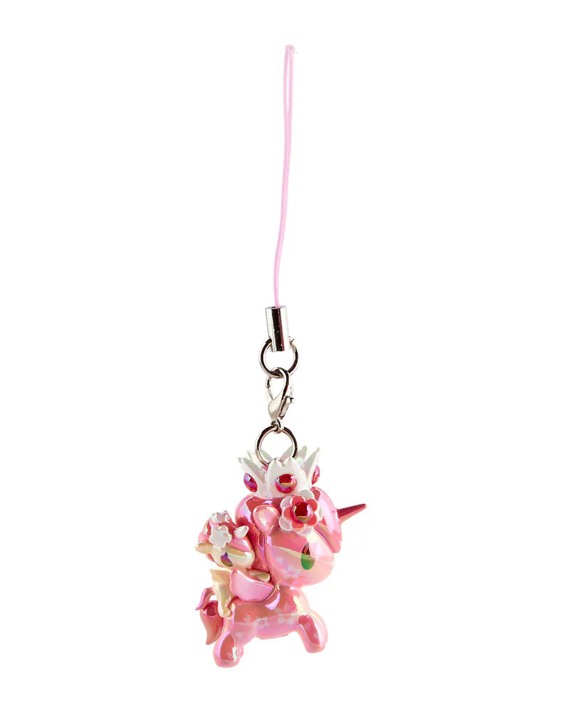 Glossy pink unicorn charm with flower crown and fairy, hanging from a pink cord. Part of Shimmer Cherry Blossom Unicorno Frenzies Blind Box.