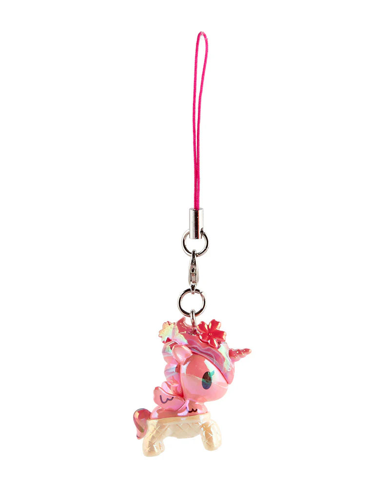 Shimmer Cherry Blossom Unicorno Frenzies Blind Box: A pink unicorn charm with floral mane on a stool, attached to a pink lanyard with a clasp.