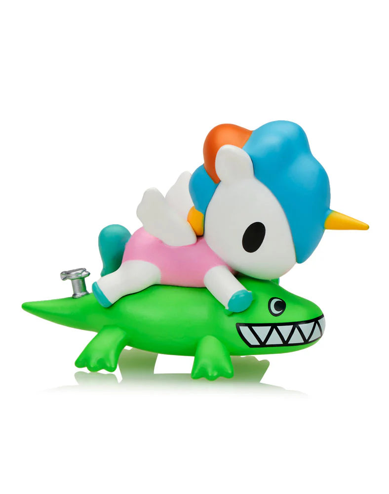 Fun In The Sun Unicorno Blind Box: Pegacorn figurine on a wind-up crocodile. Part of a beach-themed collectible series with nine unique designs.