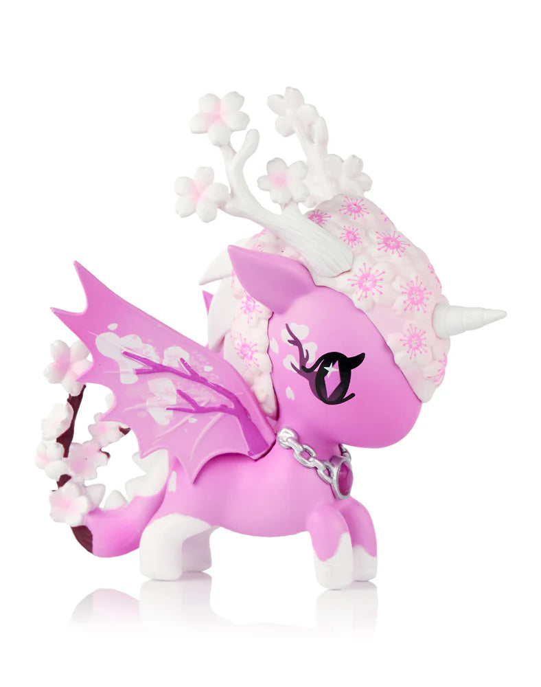 Mystical Dragon Unicorno Blind Box figure with cherry-blossom-themed unicorn-dragon design, featuring blossoms, antler branches, dragon wings, and decorative chain.