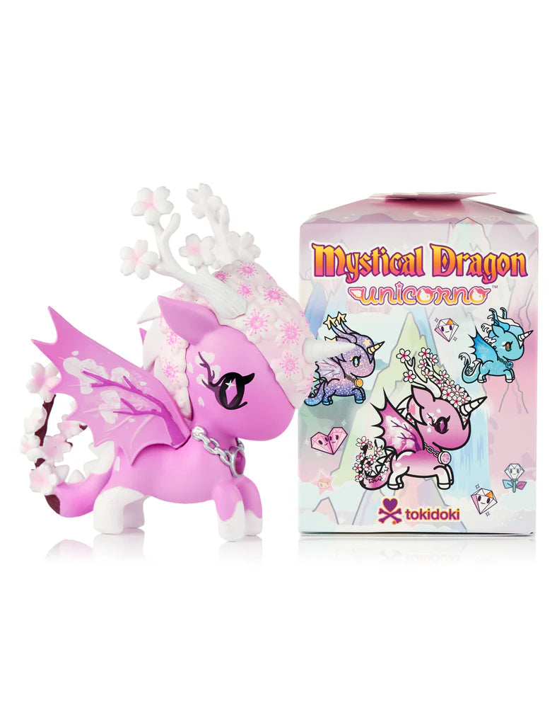 Mystical Dragon Unicorno Blind Box featuring a pink unicorn-dragon hybrid with cherry blossom motifs, antlers, petal wings, and collectible packaging.