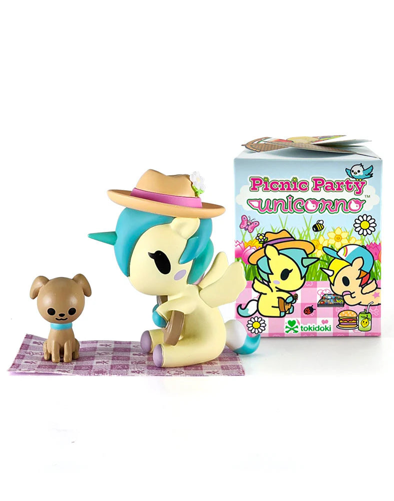Tokidoki Picnic Party Unicorno Blind Box set featuring a pastel-yellow unicorn with a teal mane and a tan dog on a picnic blanket.