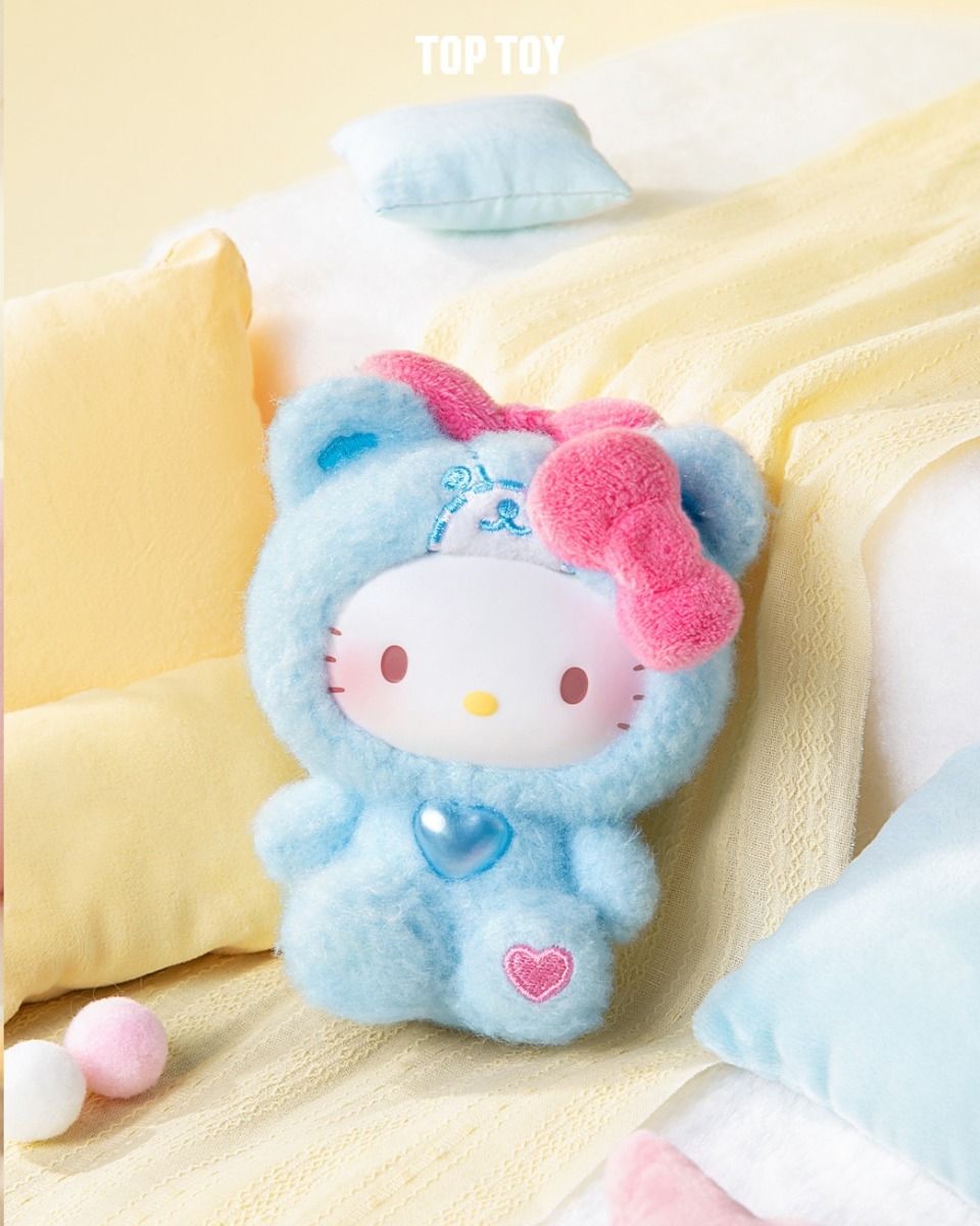 Sanrio Teddy Pajamas Plush Keychain from Strangecat Toys, featuring Hello Kitty in a bear costume with pink bow, heart accents, on a cozy blanket. Preorder available.