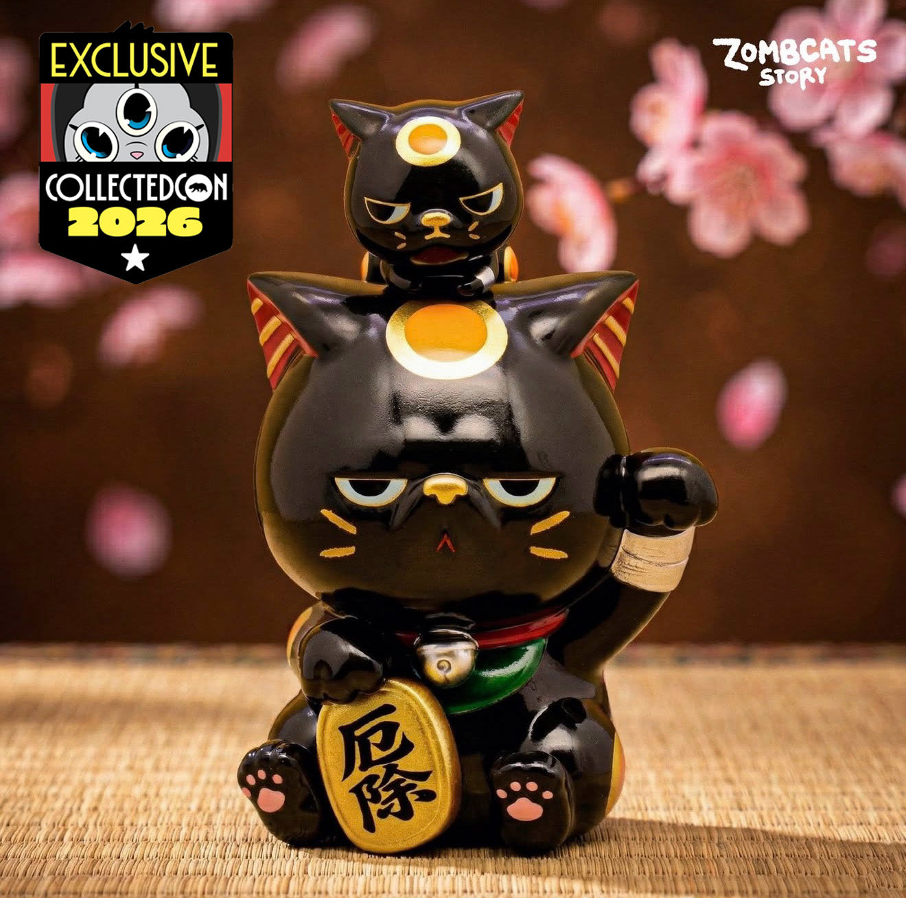 Zombcats Story - Grumpy Maneki - Yakuyoke vinyl figure with raised paw, bell collar, and kitten on head, branded EXCLUSIVE CollectedCon 2026.