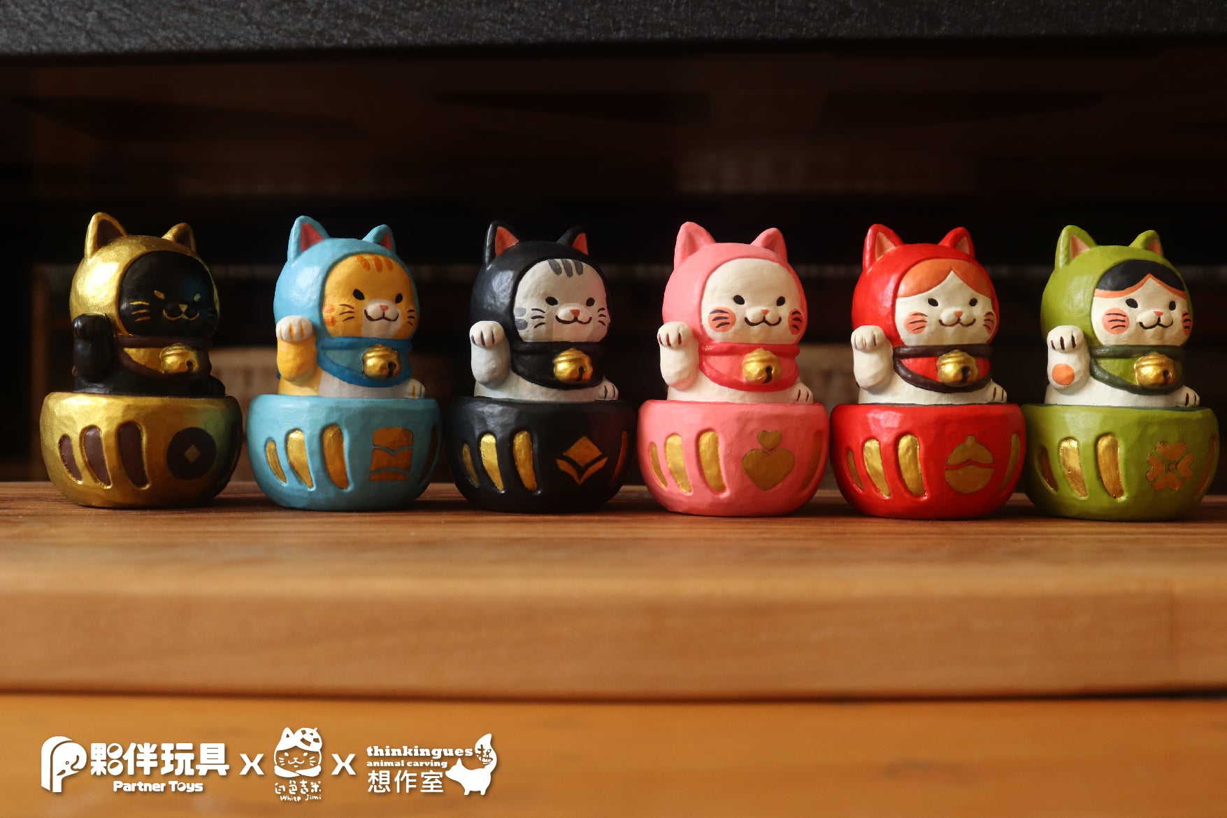 Daruma Fortune Cat Gacha Series: A group of small ceramic cat figurines and statues.