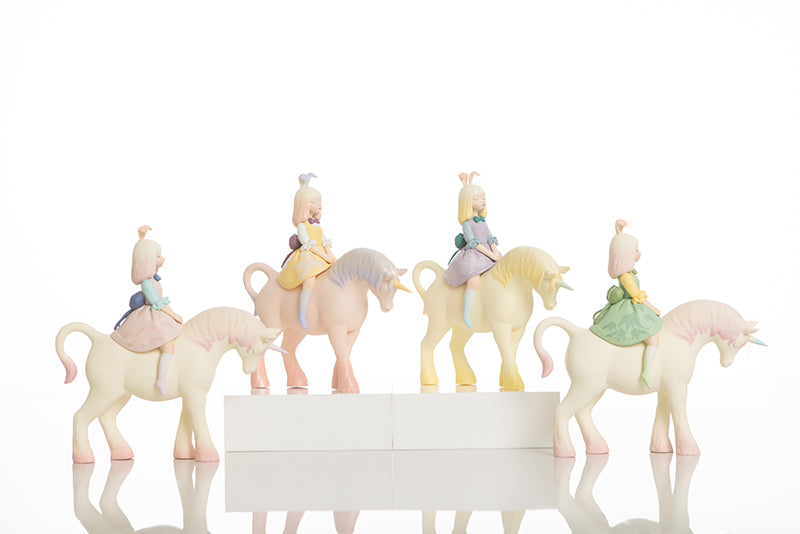 White Night Fairy Tale figurines: plastic horse toys with girl riders, unicorn detail, and statue of girl on horse.