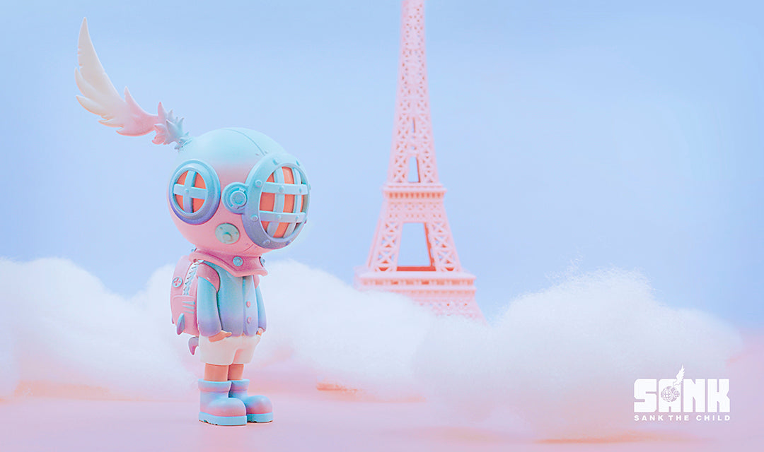 Toy in front of tower with garment, sky, cartoon, animation tags. Size 5cm, 5.8cm, 16.5cm. Limited edition signed and numbered resin figure with UV reactive mask and shark backpack attachment by magnet.