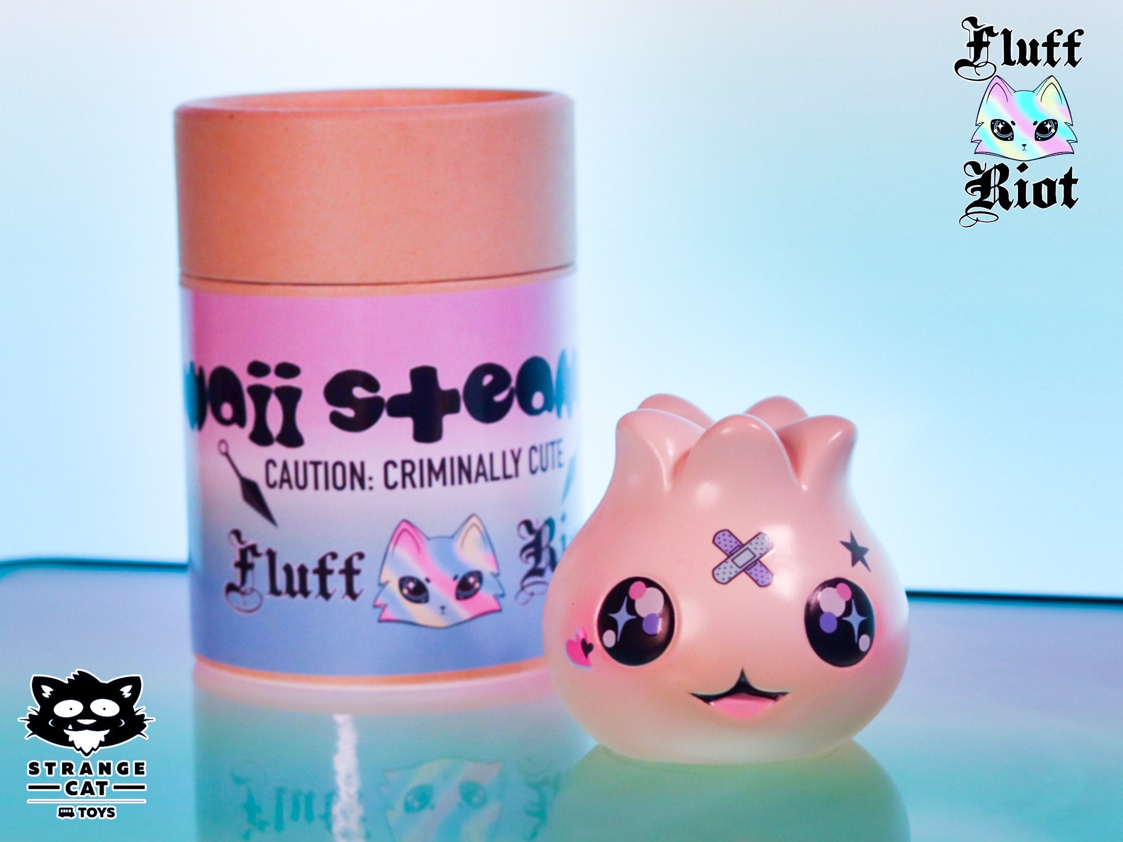 Toy dumpling with bottle, cat cartoon, and logo details by Fluff Riot.