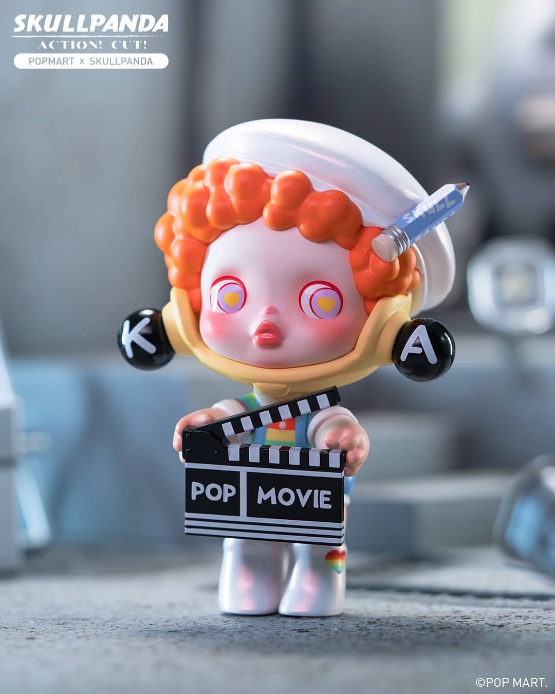 Toy figurine from Action Cut! Blind Box Series by Skull Panda holding a clapper board.