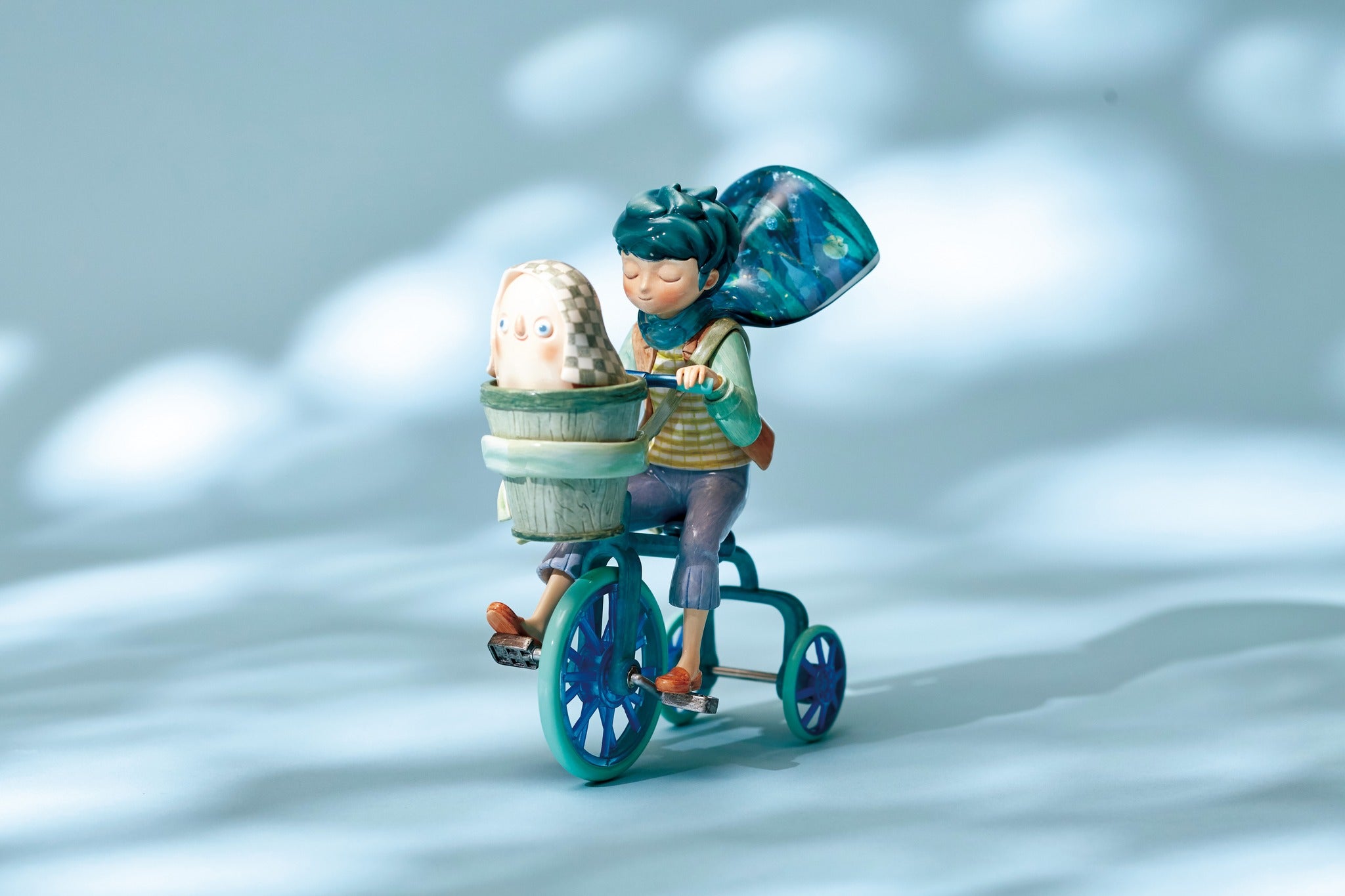 Sigh Galaxy 300% by Zu & Pi: Toy figurine of a girl riding a tricycle with a wheel detail.