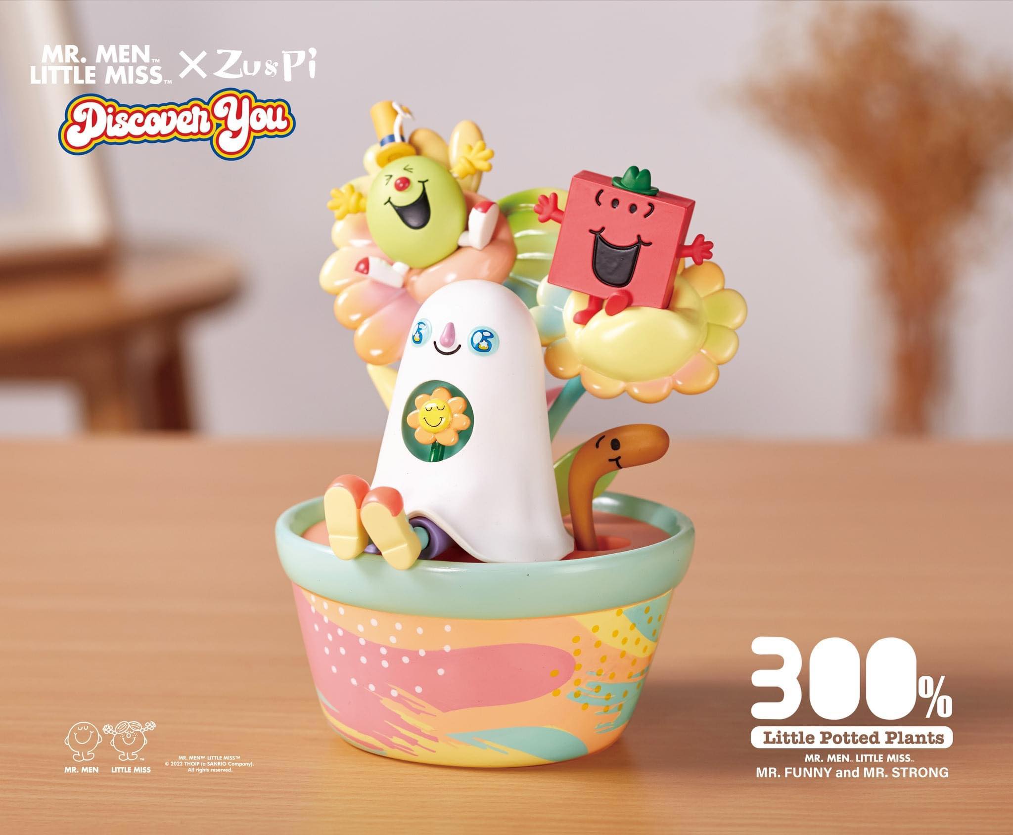 Mr. Men Little Miss toy in cup with flower, close-up.