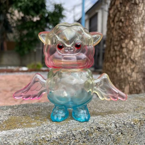 Japanese Sofubi Lambdan Rainbow Glass by Art Junkie, plastic owl toy, tree trunk, glass jar, and more in image.