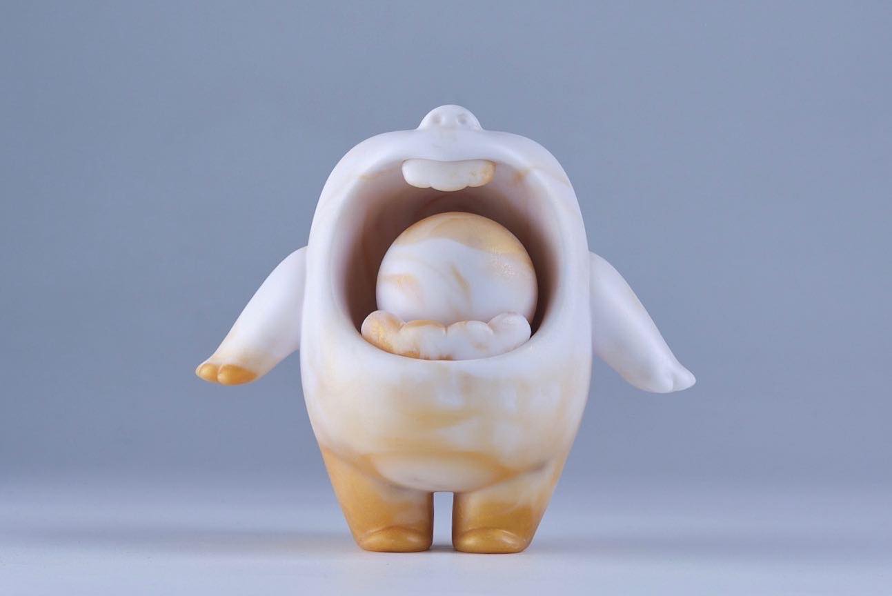 A limited edition resin figurine of Mallow Golden Caramel by MUPA Toy, featuring a detailed statue with various close-up views.