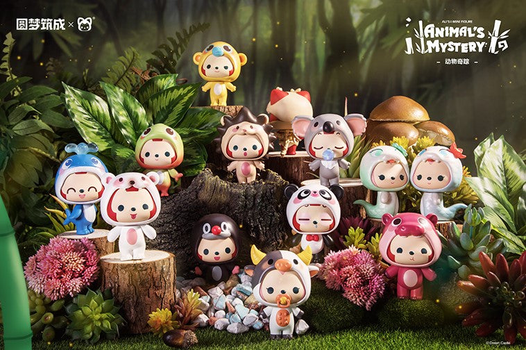 A group of small animal figurines in a forest, including Ali The Fox from the Animal Mystery Blind Box series.
