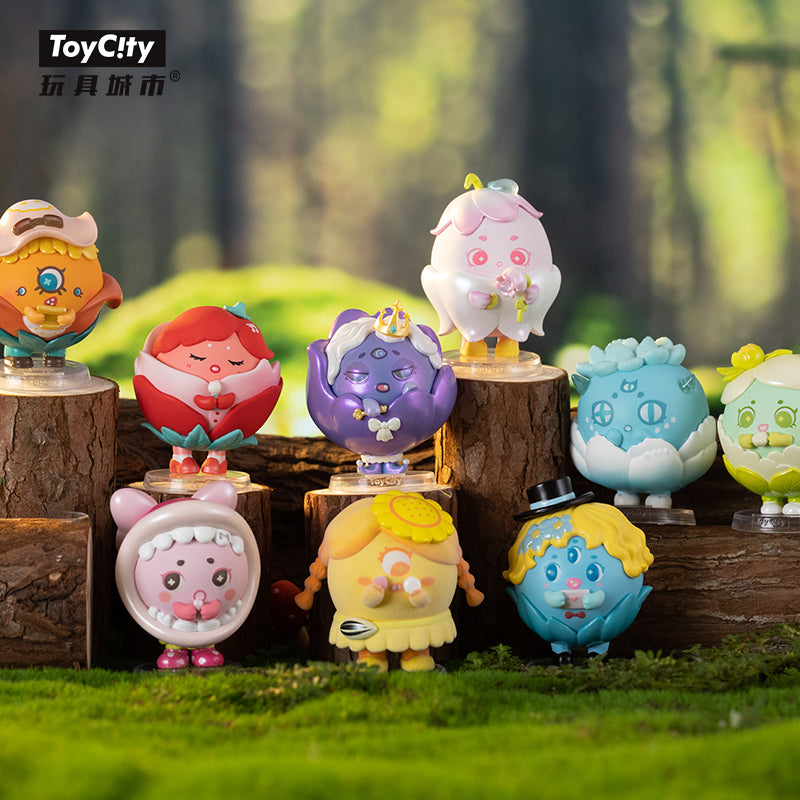 A group of small toys featuring various designs from the Pompon Monster Blossom Blind Box Series.