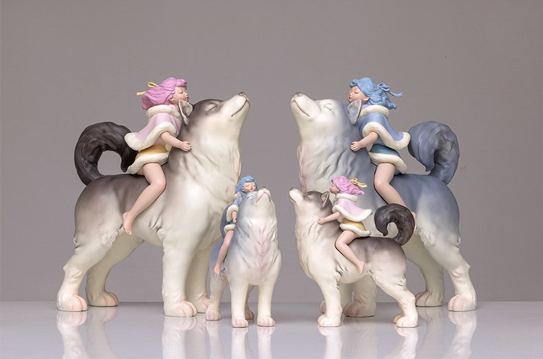 A group of dog figurines, a child on a horse, and a girl riding a wolf statues from White Night Fairy Tales - Cloud Chaser collection in small and medium sizes.