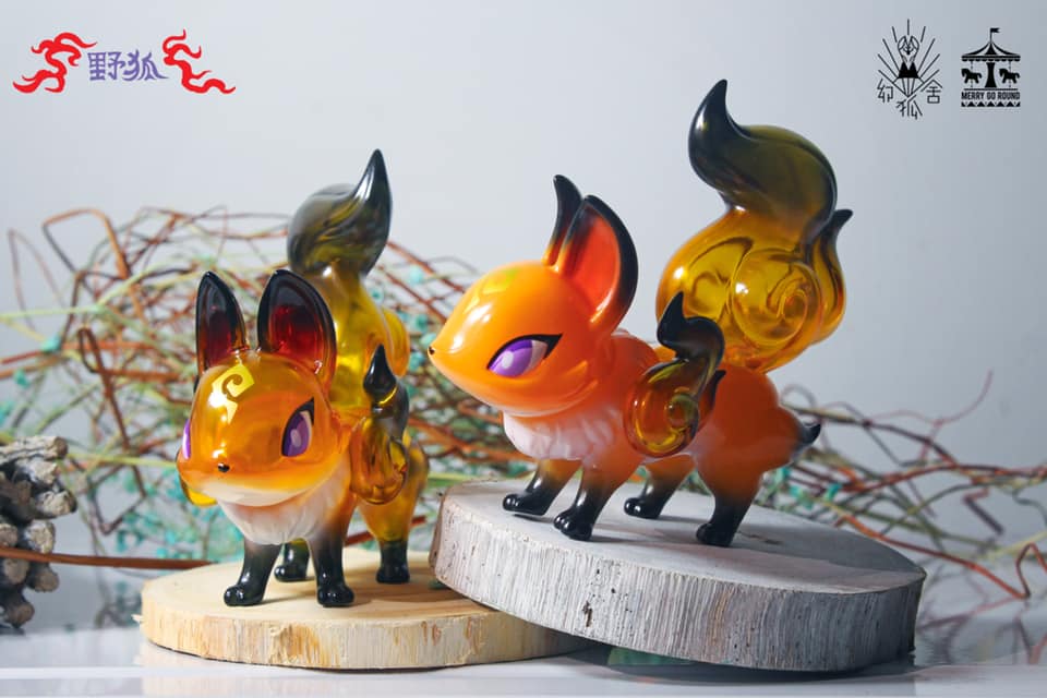 A group of toy fox figurines, including The Phantom Fox - Wild colorway by Genkosha, made of soft vinyl.