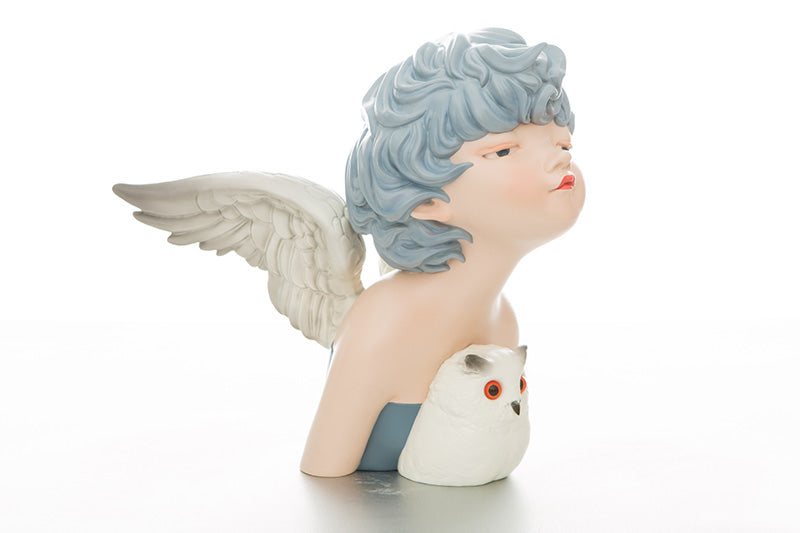 Statue of a woman with wings holding a white owl figurine by Steven Jia, poly resin, 32x35x30cm.