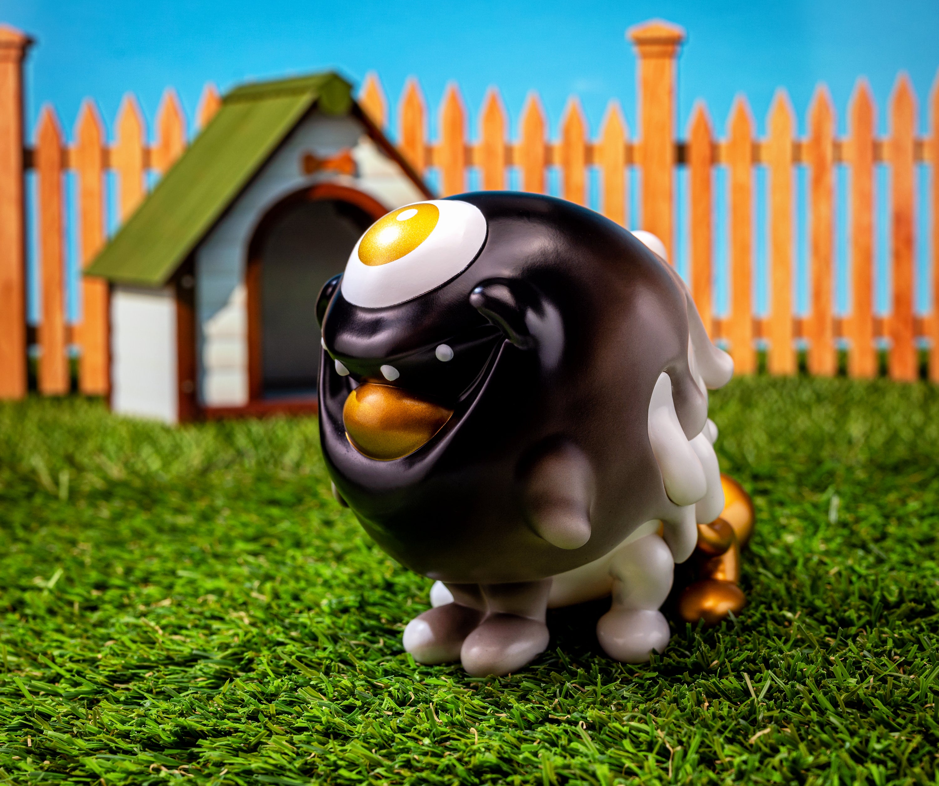 Toy dog figure on grass, inspired by classic cartoons, limited edition Gellog - Black & Gold by Blackbox.