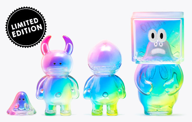 A group of colorful plastic toys in the Diagonal Rainbow Series, featuring a variety of close-up toy designs with cartoon-like features.