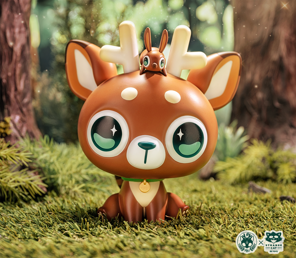 Toy animal figures DeerCat & Friends By Amber Aki Huang in outdoor setting.