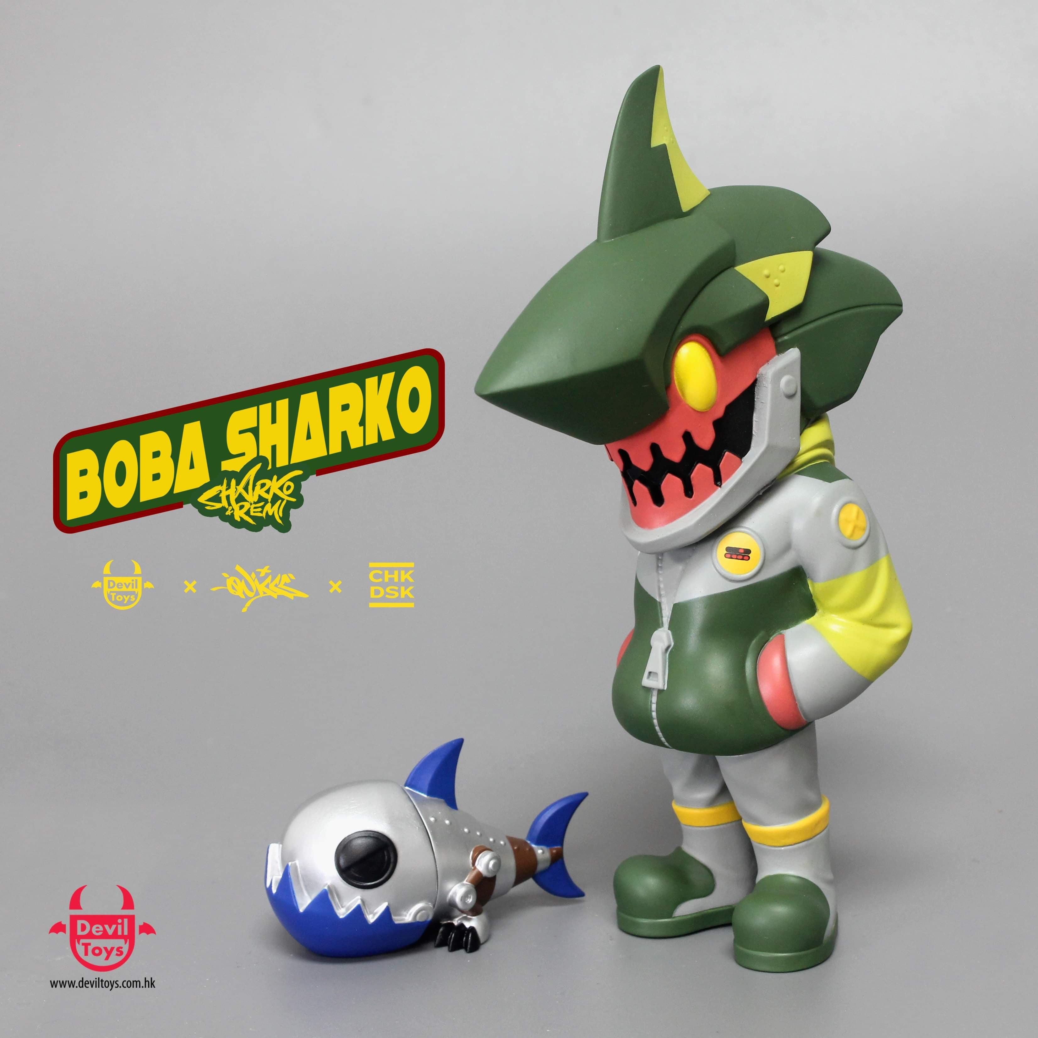 Toy figures of Boba Sharko & Remi by Quiccs x CHK DSK x Devil Toys with a toy fish and logo.