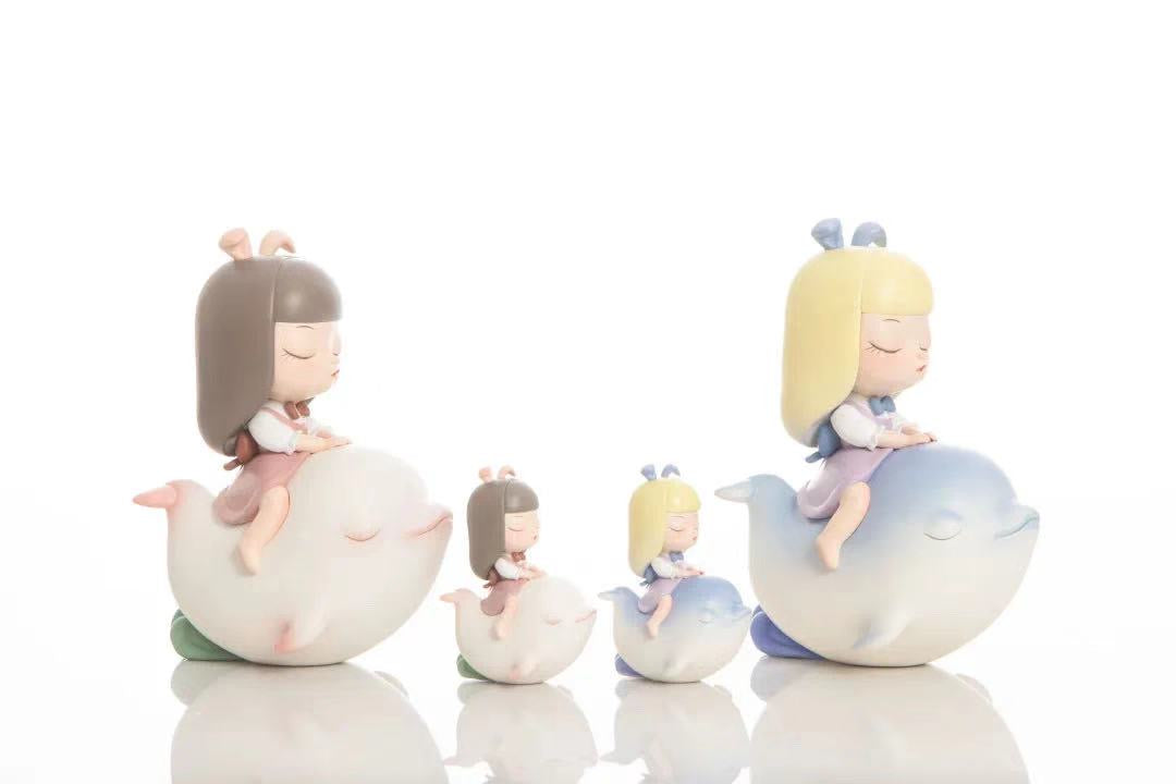 Figurines of girls riding whales and ducks, inspired by Song of the Sea - Morning Star Dolphin.