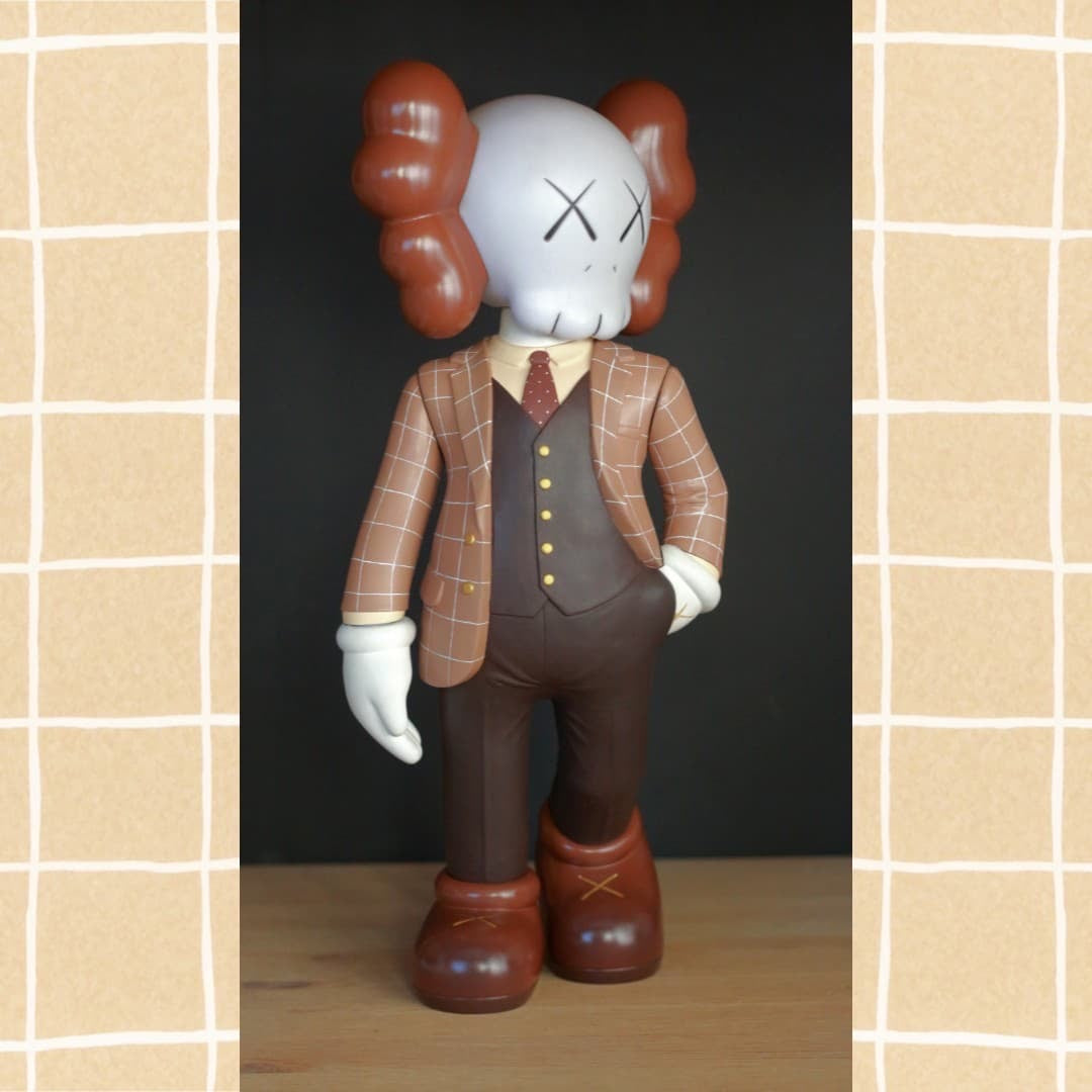 Toy figure with skull suit, cartoon character statue, brown shoes, piggy bank, plastic object, grid, rabbit statue, Misappropriated Icon 3 - Smart Kaws by Bakumbaa.