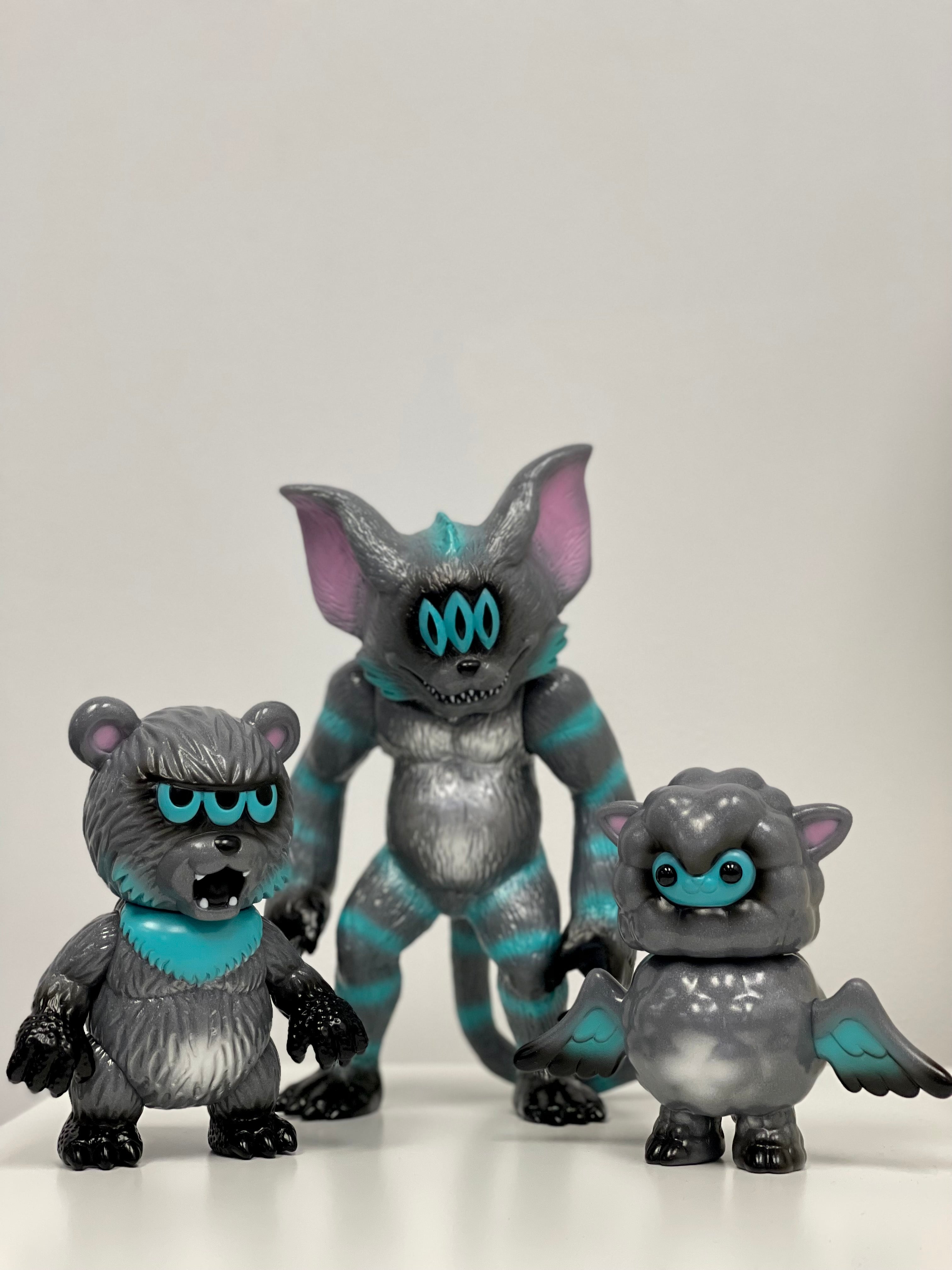 Limited edition Japanese Sofubi Hollywood Cheshire by Art Junkie toy figures: Kumara, Lambdan, and Violent Cat, with unique animal features and cartoon style.