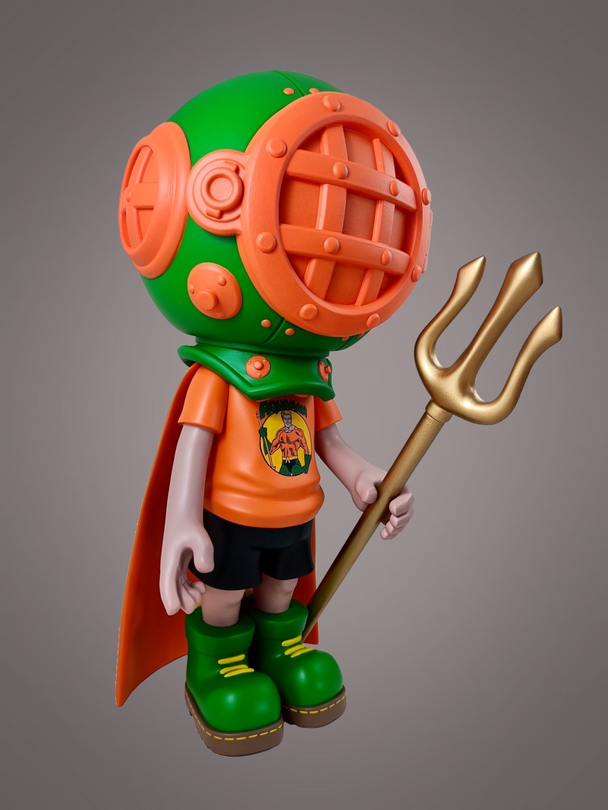 Toy figure with a helmet and trident, close-up of a cartoon, statue with green shoes, holding a gold pitchfork.