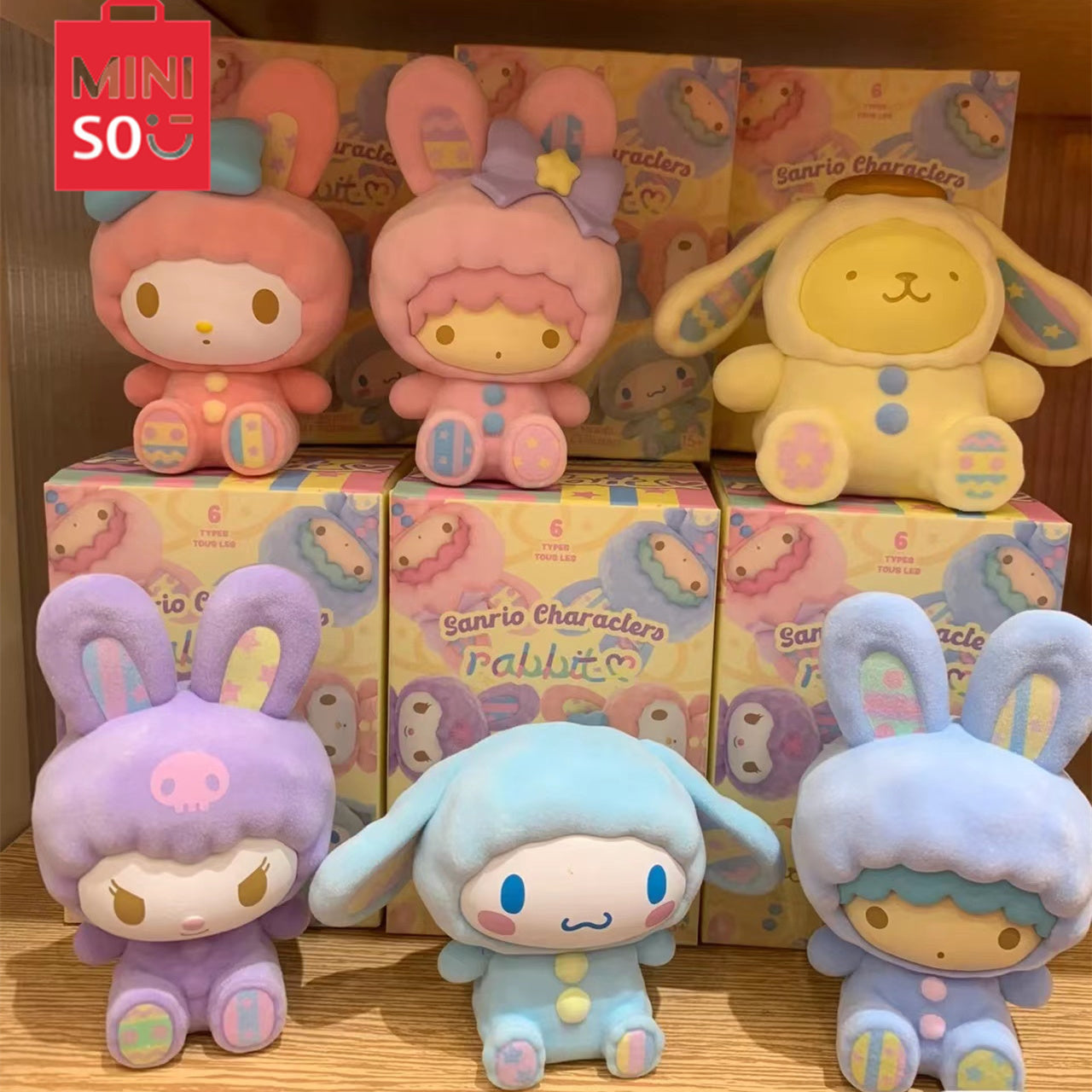 Sanrio Rabbit Blind Box Series featuring a variety of plush toys, including a purple stuffed animal with a skull, a toy with bunny ears, and more.