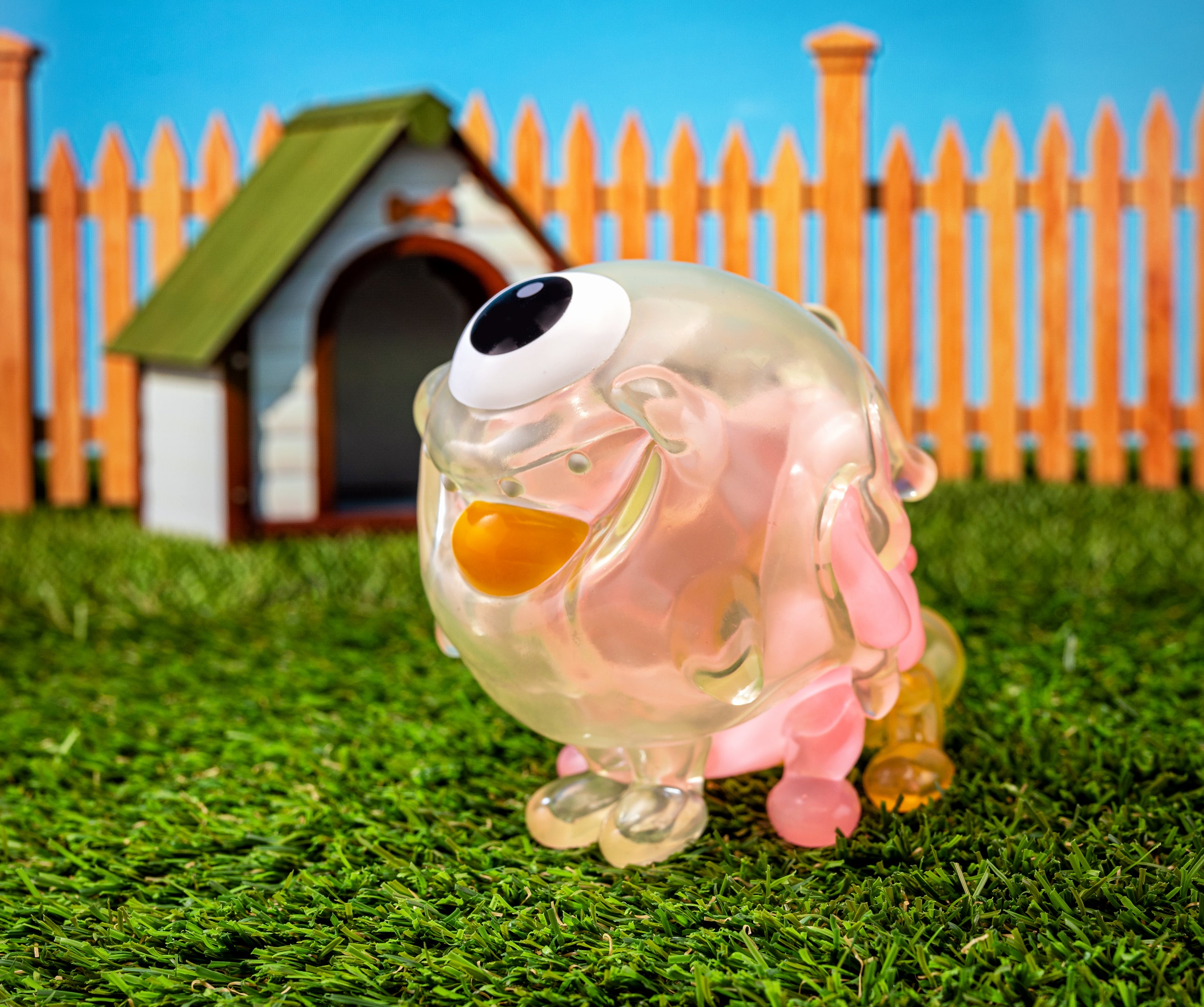 Gellog - Ice Cream toy by Blackbox on grass with a plastic duck and dog house.
