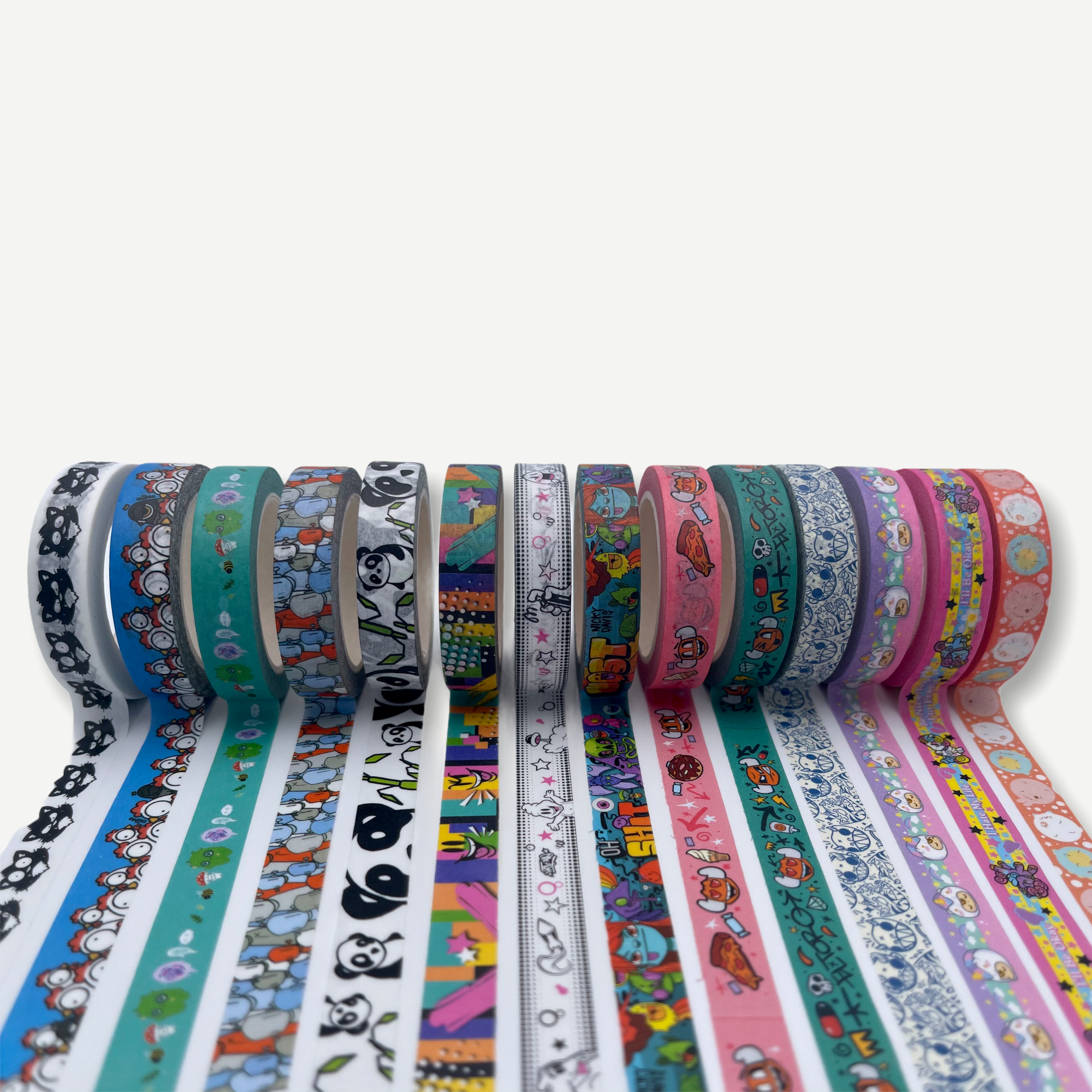 Washi Tape - Artist Series 1: Rolls of decorative tape with various patterns, including a close-up of a border and a panda design.