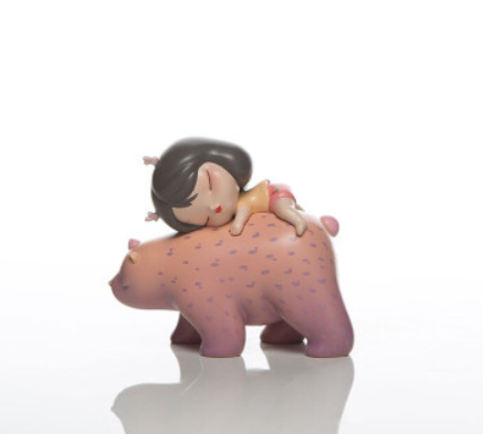 Figurine of a girl hugging a bear, sleeping on a bear. Created by Steven Jia.