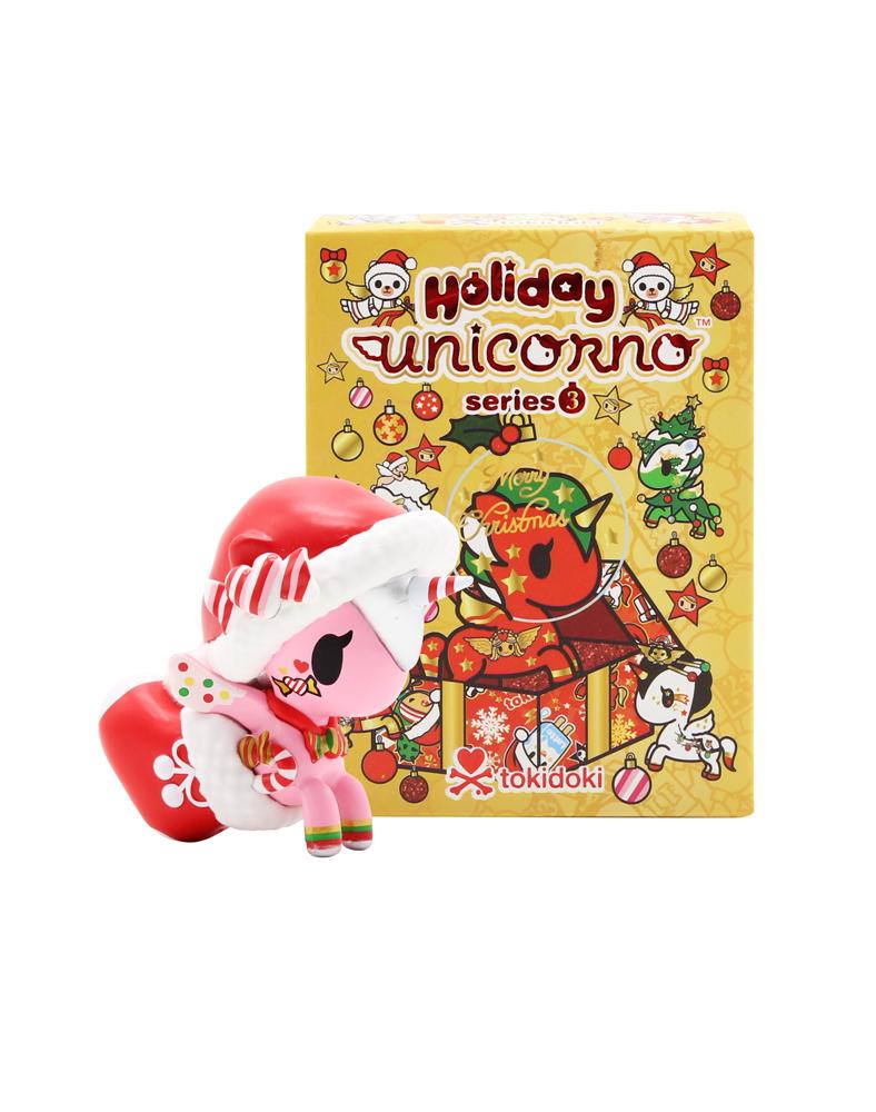 Unicorno Holiday Series 3 toy figurine with hat and bag next to box, part of a blind box collection.